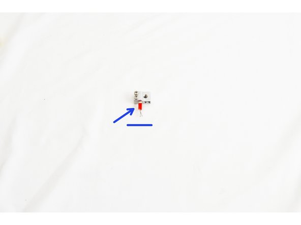 Secure the heater cartridge in the heater block by tightening both of the M3 - .5 x 10mm screws.