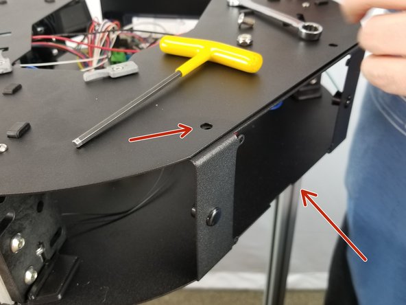 Note the shorter bolt will go on the front of the machine in the position of the arrow.  The front of the machine is the side with the large hole in the upper frame as shown in Pic 1.