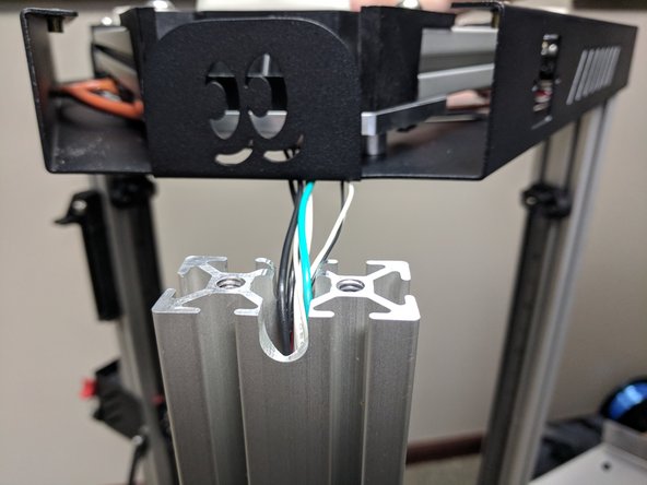 Fold the wires over into that channel in the T-Slot and hold them there to give them some memory.