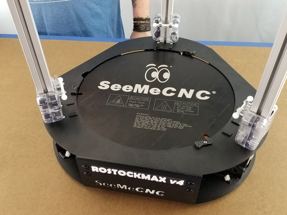 Slide the carriage over the aluminum extrusion with the ball joints on the top and facing the inside of the machine as shown in the pics.
