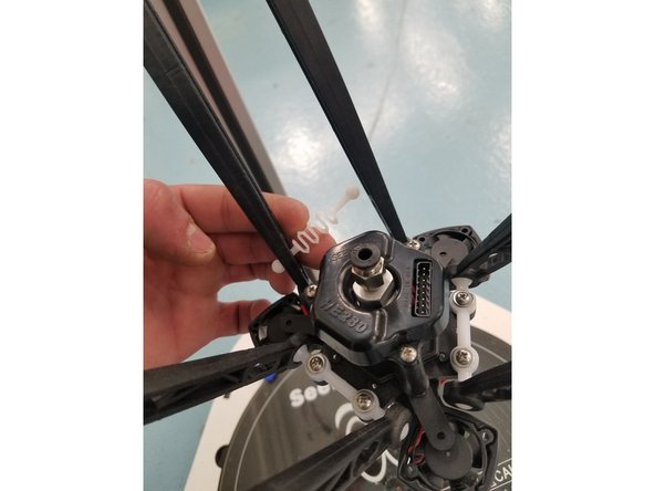 The Next step is removing the Hot End and Injection Molded arms. To do this start by removing the 3 white plastic springs located near the Hot End.