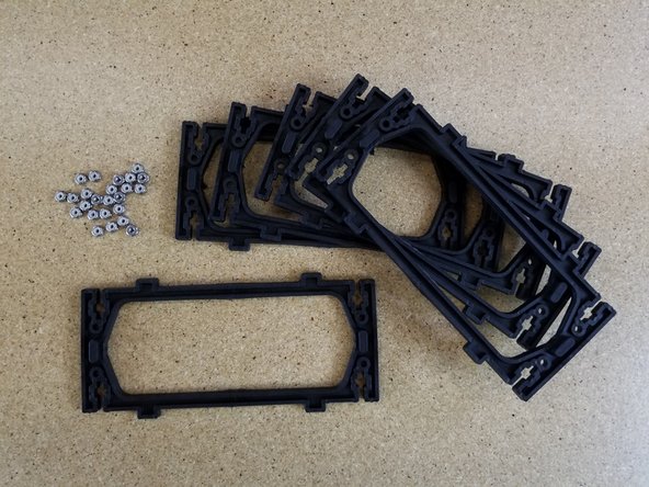 Insert nylon lock nuts into the side plates (as done in previous steps). You will use a total of (24) nylon lock nuts.