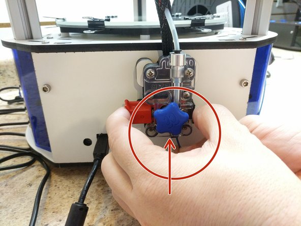 Set the filament spool on the spool holder arms with the filament coming off of the top of the spool.