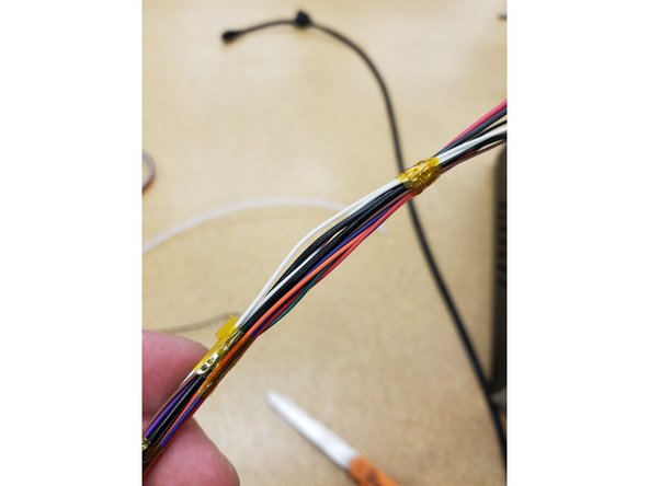 Tape the new whip wires to the end of the filament line. You may need to tape it in multiple places to make sure it's attached well. You don't want to lose your wires in the tower and start all over again.