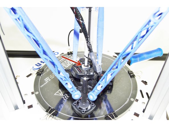 With the Bowden (PTFE) Tube pressed down, you will now lift up on the black ring in the top of the hot end.