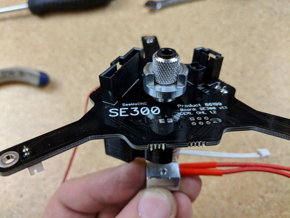 The heater block should be in line with  the part of the PCB with the words silk screened on them, with the heater screw being on the side  under the electronic components for the pcb.