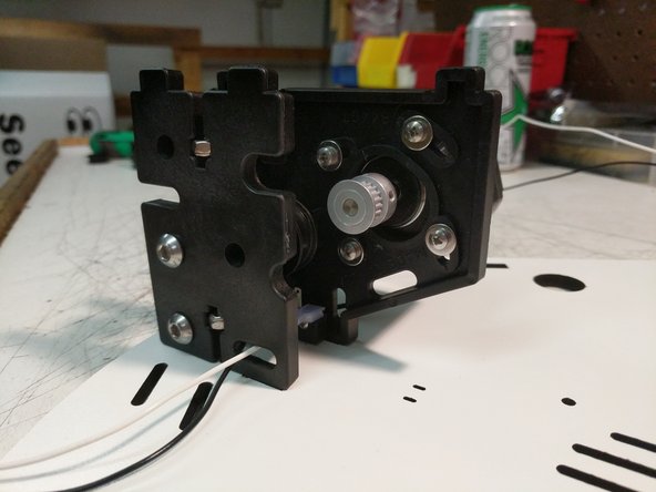 You can now attach the idler motor plate to the motor mount plate using (2) #4 x 1/2&quot; screws. The plate can be tilted into position. You will then need to align the bosses of the plate with the bearings and press the plates together.