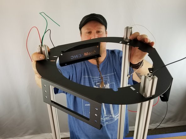 Feed the wires and aluminum through the 3 corner holes of the sheet metal and slide it down to the base of the machine.