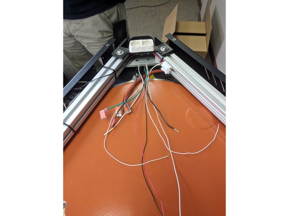 Machines starting in February 2018 have a 3 position Wago attached to the heated bed red wire eliminating the need for an extra Wago connector.   Machines before February 2018 may have an extra Wago 2 position connector.