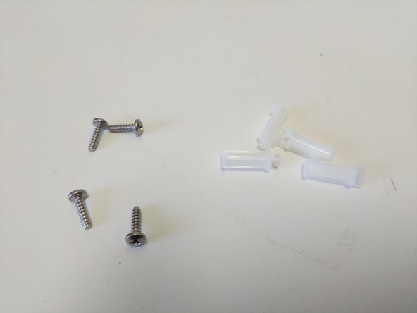 Locate the base assembly base plate (shown in image), (4) #6 x 1/2&quot; sheet metal screws, (4) board supports.