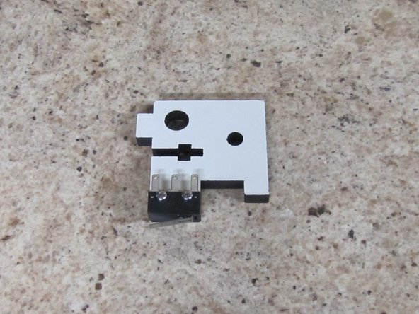 Locate (1) of (2) Upper TSLOT Mounts, (2) 2-56 x 5/8&quot; Pan Head Machine Screws,  (2) 2-56 Finish Nuts, and Pre-terminated End Stop Wires.