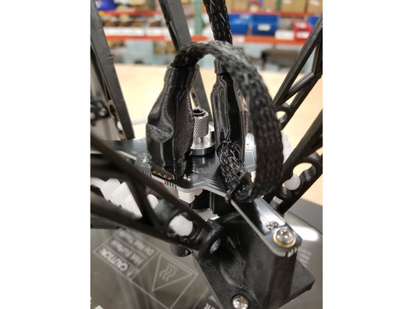 Slide the boots in to place, routing the whip extension through the opening in the back of the 10 pin boot as shown.