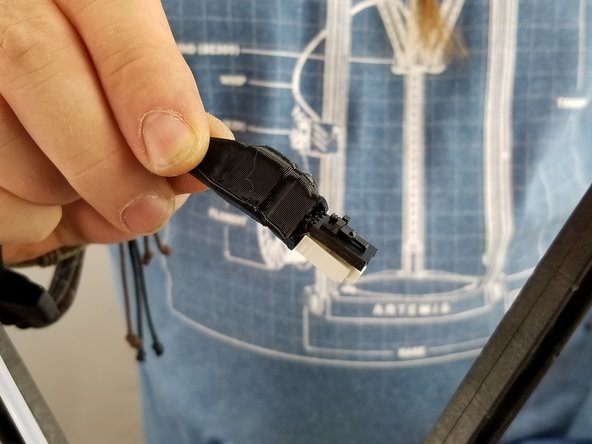 Slide the boot up the square plug and expose the 2 clips inside it as shown in Pic 1.