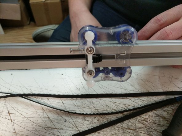 Routing the belts is best completed by laying the machine down on its side.