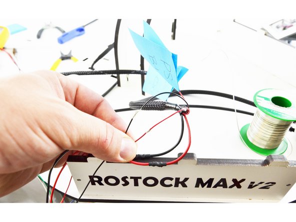 Perform an in-line splice of the wires. Red to red, black to black.