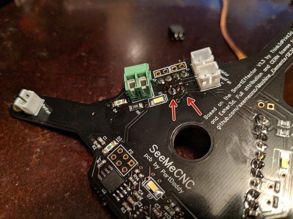 Solder the two legs to the PCB as shown in Pic 2 to secure the power plug in place.
