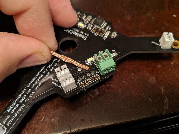 Place the desoldering braid over the first heater connector solder point as shown in Pic 2.