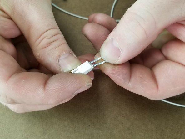 The two white wires will go into one two pin connector.  Polarity does not matter.
