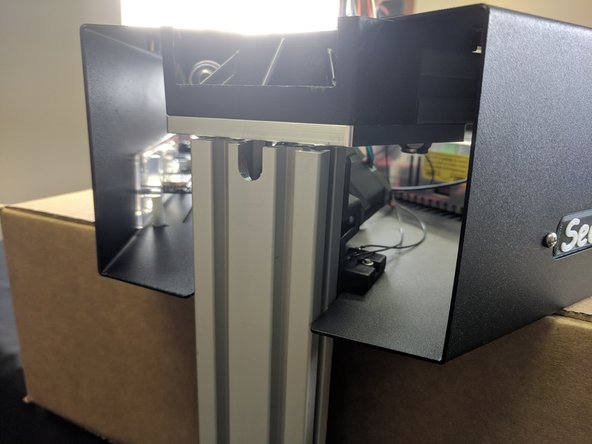 You will now lift the tower and slowly slide it into the upper assembly. The tower assembly will clear the limit switch. As you are sliding it into place you will need to ensure that the wires stay down in their relief, otherwise they will get pinched when tightening the plate.