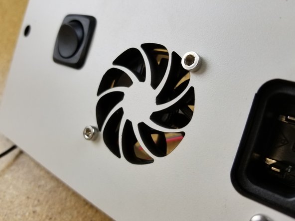 The fan should be installed so that it will blow OUT through the panel. (The foil sticker is should be facing towards the laser cut panel)