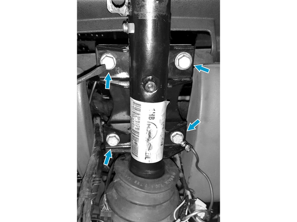 Retire os 4 parafusos que fixam o suporte da coluna de direção ao painel.