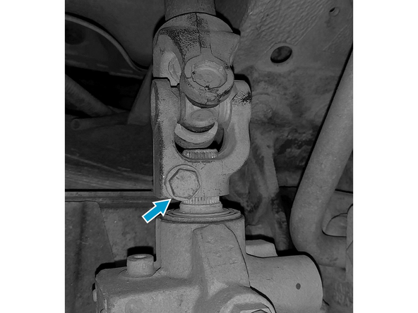 Retire o parafuso sextavado de fixação da coluna à caixa de direção.