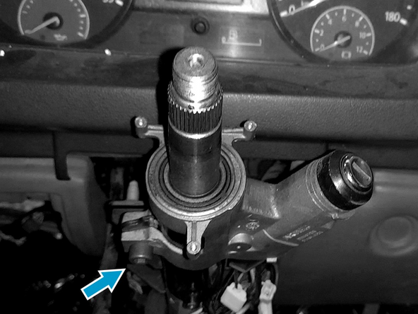 Instale o comutador de ignição com rolamento superior e torqueie o parafuso.