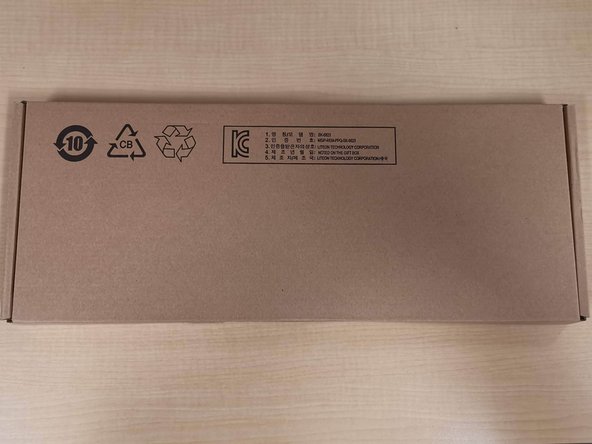 Open the keyboard box, and carefully remove the plastic from the keyboard.