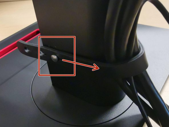 Unstrap the cables from the arm