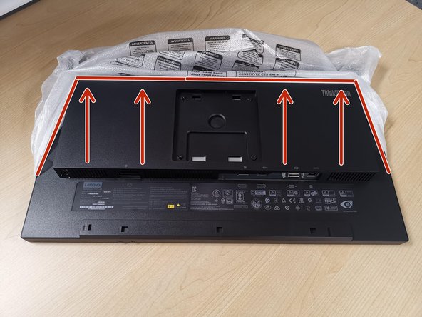 With the monitor facing down: