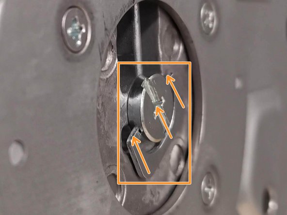 Place the monitor arm and base on its side so you have access to the bottom