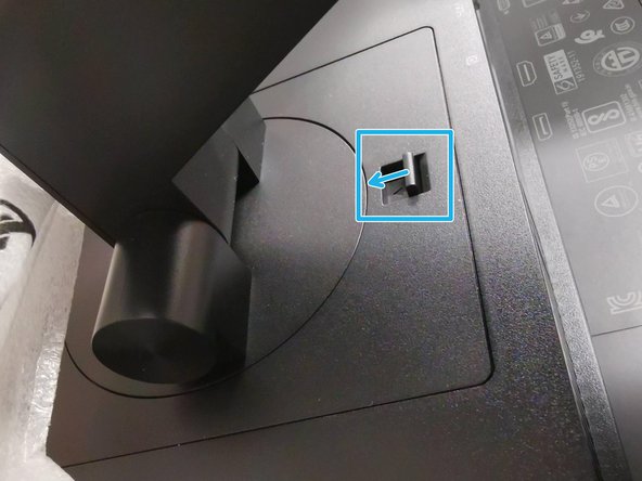 Place the monitor into the bottom Styrofoam piece in the box