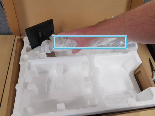Replace the Monitor Arm into the Styrofoam
