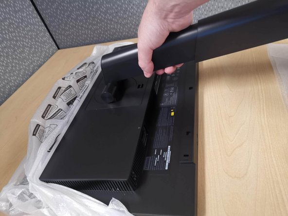 When moving your monitor, grab it by the arm. Stand the monitor upright.