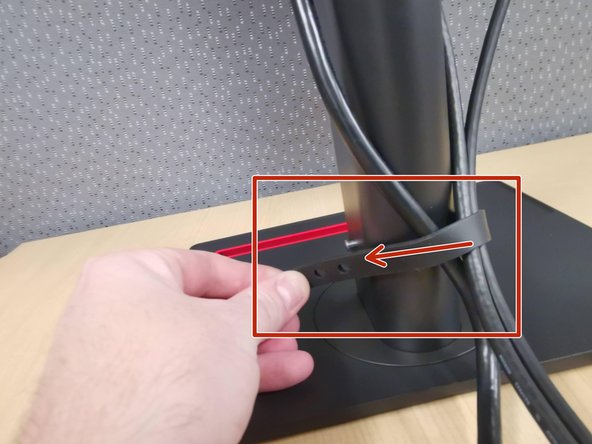 Organize your cables using the strap at the base of the monitor arm