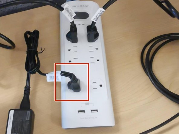 Connect the AC cable to the surge protector