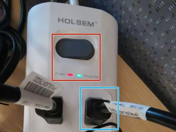 Connect the monitor's power cable to the surge protector