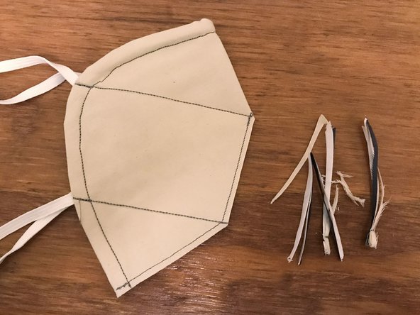 Using your scissors, trim along the front seam that you just sewed, leaving about 1/8&quot; (3 mm) of material between the sewn line and the edge.