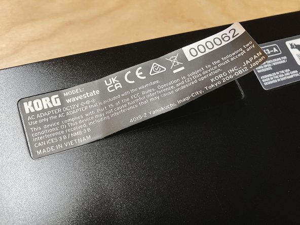 Place the aluminum desktop enclosure on your work surface, with the bottom side facing up.