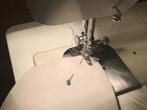 Starting at one corner, sew along the entire length of the curved edge.