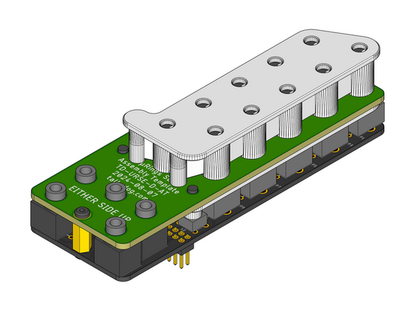 Make sure that the flat side of the Assembly Cap is facing up when orienting it relative to the top surface of the Control Board as shown.