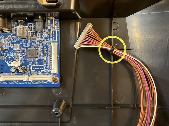 Disconnect the keyboard connector from the main board, the same way that you disconnected the other two cables.