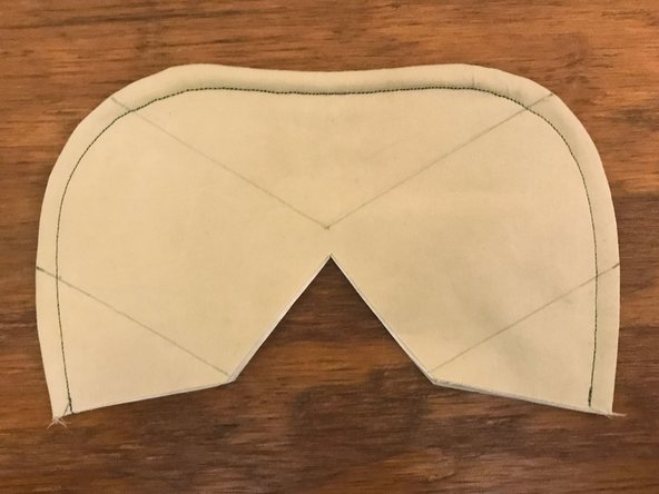 Place the mask on top of the pattern again, aligning the bottom edges.