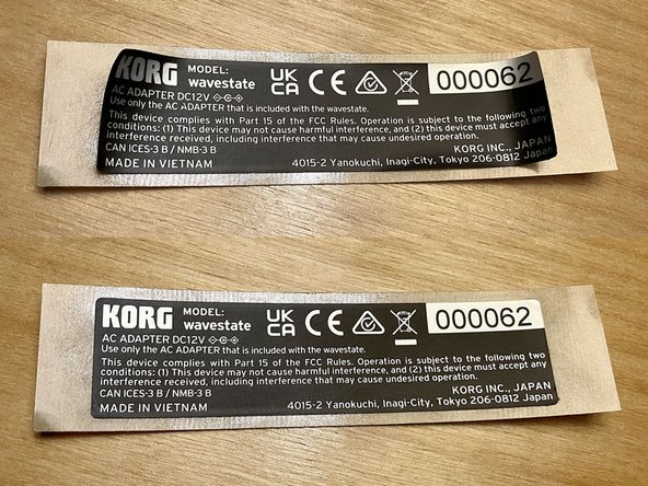 Tip sent in by a customer: Use a hairdryer or heat gun on low to soften the adhesive, making the label easier to remove. Doing this may even make it entirely unnecessary to use the double-sided tape, so long as enough of the original adhesive remains on all edges and corners of the label after removal.
