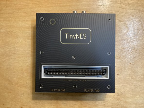 Remove the Top Panel from the TinyNES enclosure by unscrewing the 8 marked screws.