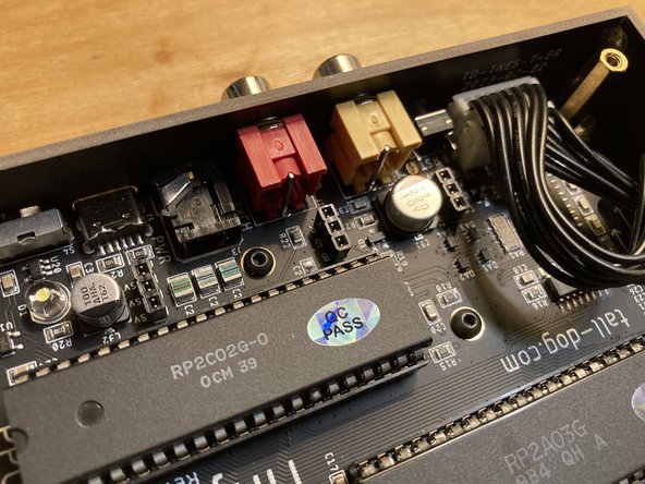 Lift off the white plastic jumper board spacer and put it aside.