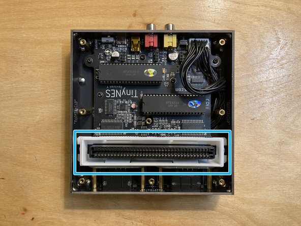 Lift the top panel off of the enclosure and put it aside.