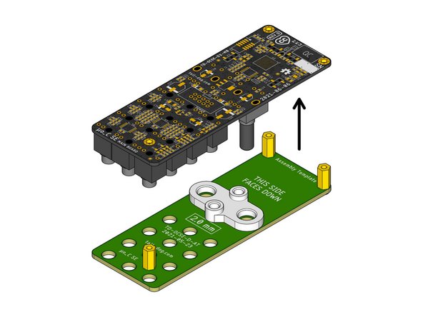 Gently lift the Main Board away from the Assembly Template and the Assembly Spacer. They should both slide off easily without applying much force.