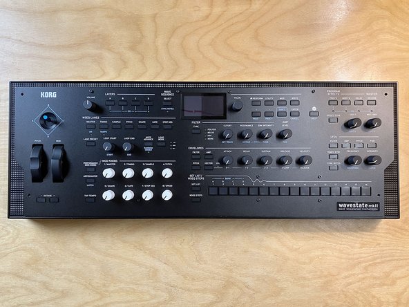 While repositioning the front panel, make sure that the wrapped cable is not caught on or blocking any of the plastic bosses as the panel is moved.