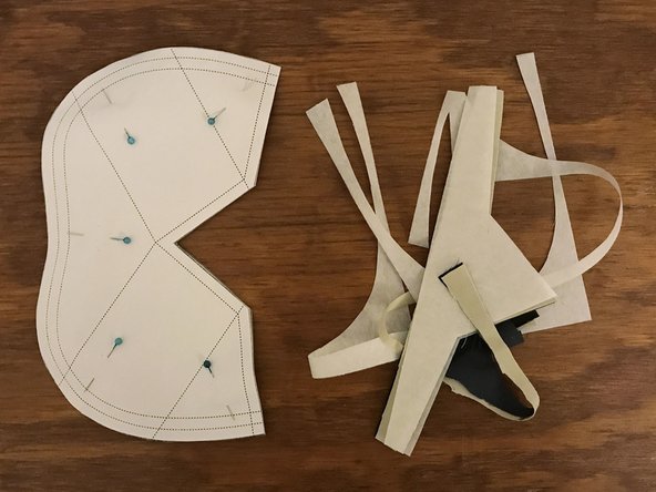 Carefully cut around the outside edge of the pattern, through all four layers of material.